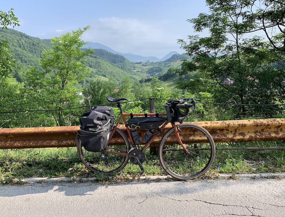 Phil's bike upside-down, leaking sealant in the middle of the alps